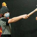 Justin Mampel gets ready to throw a axe.